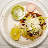 Sopes · its a fried corn tortilla, with beans and meat of your choice, coriander, onion,  milk cream...