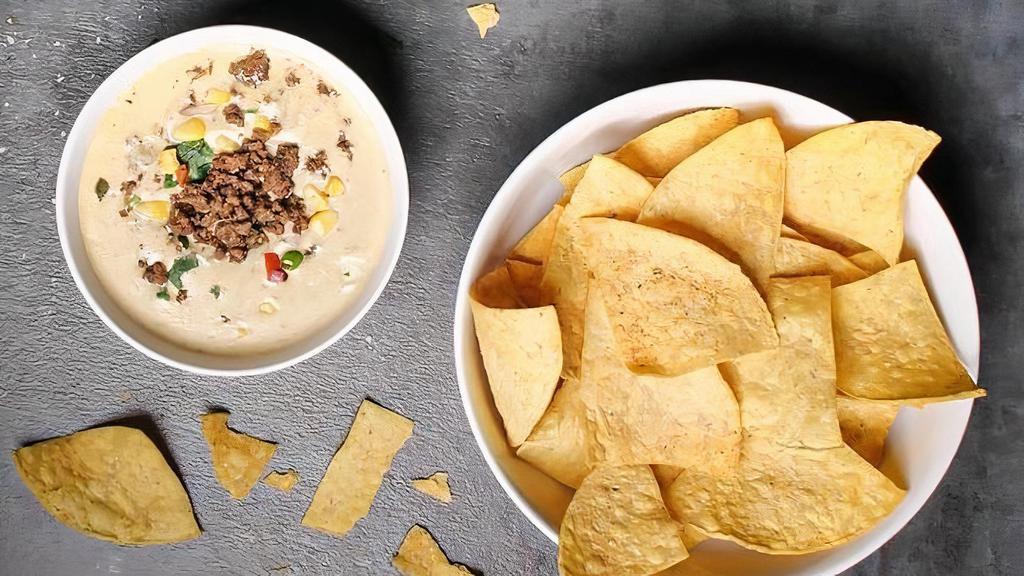 House Chips And Queso · Shareable portion of House White Jalapeno Queso and Seasoned Chips. *Add-ons Available for an Additional Charge*