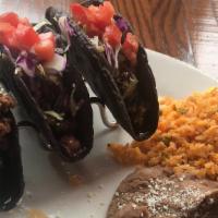 Cantina Ground Beef · red cabbage, shredded lettuce, tomato, cotija, crispy blue corn tortilla