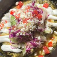Enchiladas · red cabbage, shredded lettuce, tomato, sweet onion, lime crema, queso fresco