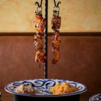 Adobo Chicken Skewers · peppers, onions, chimichurri butter, served with rice, beans, flour tortillas, salsa verde