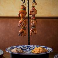 Chili-Lime Shrimp Skewers · peppers, onions, chimichurri butter, served with rice, beans, flour tortillas, habanero salsa