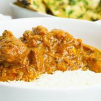 Lamb Curry · Lamb cooked with herbs and spices in gravy sauce.