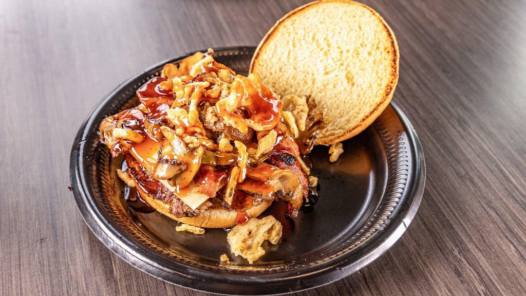 Mamas Bourbon Smash Burger · 1/3 lb smash burger with crispy onion, grilled mushrooms, Swiss cheese, bacon, and bourbon sauce.