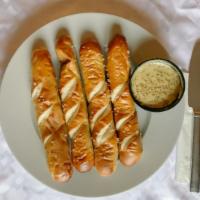 Pretzel Stix (4 Pc) · Soft baked Bavarian pretzel sticks, lightly buttered and salted with your choice of one chee...