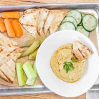 Hummus Platter · Our rotating homemade hummus served with carrots, celery, cucumber slices and pita bread.