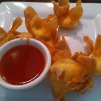 Crab Rangoons · Seafood and cream cheese filling wrapped in a crispy wonton. Served with sweet chili sauce.