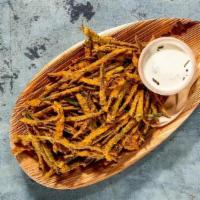 Cayenne Dusted Crispy Okra Fries · VEGETARIAN and GLUTEN FREE. . Fresh cut and flash-fried, dry seasoned, and served with PK Ra...