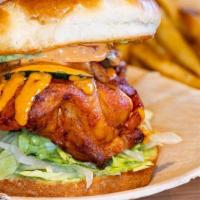 Crispy Chicken Sandwich · crispy fried chicken breast served on a toasted bun with lettuce, tomatoes, cucumbers & mayo...