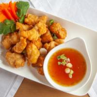 Orange Chicken · deep-fried chicken breast in tempura style, topped with homemade orange gravy sauce.