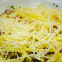 Spaghetti Carbonara · Egg yolk base sauce, bacon bits, olive oil and garlic.