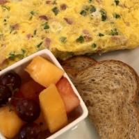 Western Omelet · Three eggs mixed with onions, green peppers, ham, and cheddar cheese.