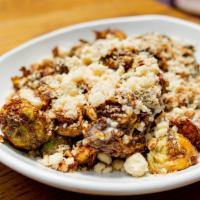 Fried Brussels Sprouts · Vegetarian. Fried brussels sprouts, pie crust, pecans, honey, creme fraiche.