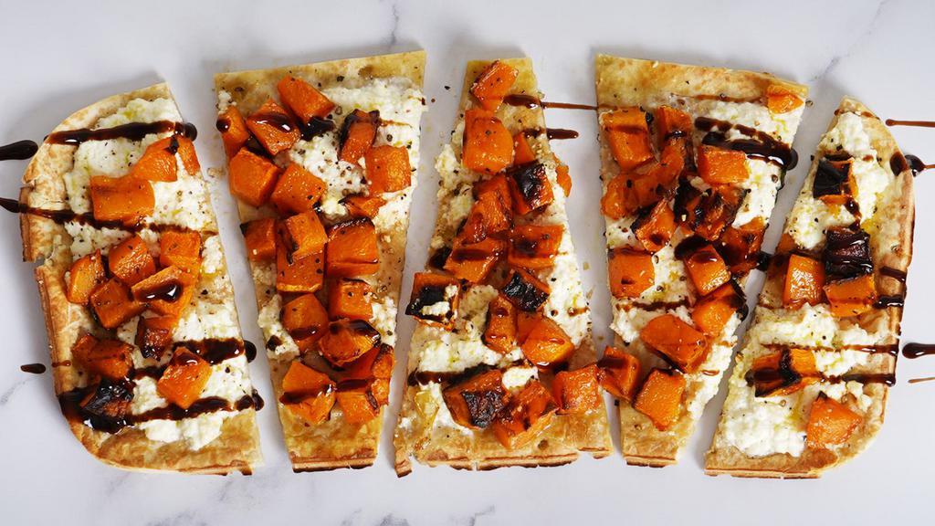Butternut Squash · Our classic flatbread topped with butternut squash, ricotta cheese, and drizzled with balsamic.