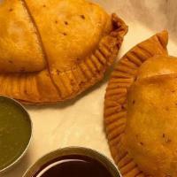 Samosa · VEGAN - Seasoned mashed potatoes fried in a pocket with a crispy and crunchy shell. Includes...