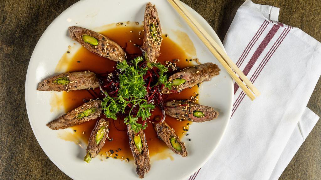 Asparagus Beef Roll · Asparagus rolled with black angus filet mignon and sautéed in teriyaki sauce