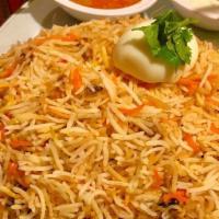 Vegetable Biryani · Basmati rice and vegetables, flavored with saffron and cooked on low heat.