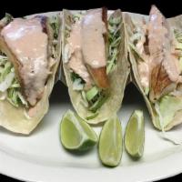 Special Fish Taco · 3 fish tacos comes with flour tortilla, cabbage, cilantro, Mexican ranch, lime and side rice.