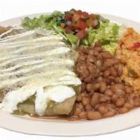 Enchiladas · Four corn tortillas rolled with filling of choice: chicken or steak, choice of green or red ...
