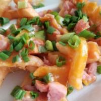 Loaded Fries · Cheese, Smoked Sausage, Green Onions & Sour Cream