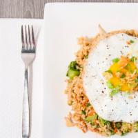Malaysian Style Fried Rice · Bean sprout, pea, carrot, broccoli, and onion. Topped with fried egg, and crispy shallots.