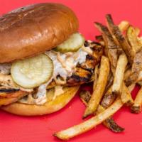 Chicken Burger · Grilled chicken topped with zesty coleslaw pickles and specialty sauce brioche bun.