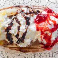 Banana Split · A split banana with a scoop of vanilla, strawberry and chocolate ice cream covered in chocol...