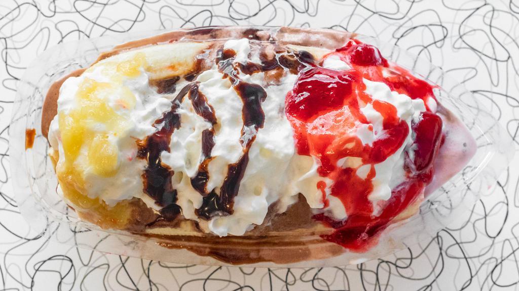 Banana Split · A split banana with a scoop of vanilla, strawberry and chocolate ice cream covered in chocolate, strawberry, and pineapple toppings. Topped with whipped cream. Add additional toppings for an additional charge.