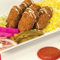 Falafel Over Rice · falafel over rice with small side of : white sauce,hot sauce,tomato,lettuce,pickles,onion