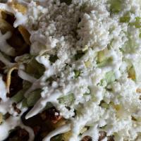 Chilaquiles · Deep fried tortillas simmered in green or red salsa topped with steak two eggs your style, l...