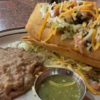 Chimichanga · Rice, Mexican blend cheese, your choice of meat, wrapped in flour tortilla. Topped with guac...