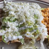 Flautas · Four flautas with chicken. Topped with lettuce, sour cream, salsa, rice and beans.