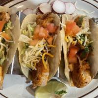 Shrimp Tacos · Homemade Tortillas, Lettuce, Tomatoes, Cilantro, Cheese, and Peanut Chipotle Sauce