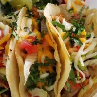 Fish Tacos · Homemade Tortillas, Lettuce, Tomatoes, Cilantro, Cheese, and Peanut Chipotle Sauce