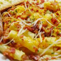 3 Cheese Bacon Caballero · Penne in a rich and creamy cheese sauce with diced bacon and melted cheddar on top.