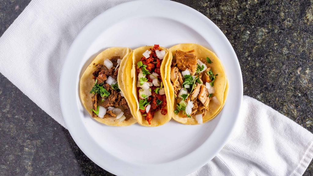 Taco · Soft corn tortilla filled with your choice of meat and topped with onion and cilantro. Single taco.