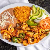 Plato Con Camarones · Sautéed steak, chicken and shrimp with tomatoes, bell pepper, onions and jalapeños, served w...