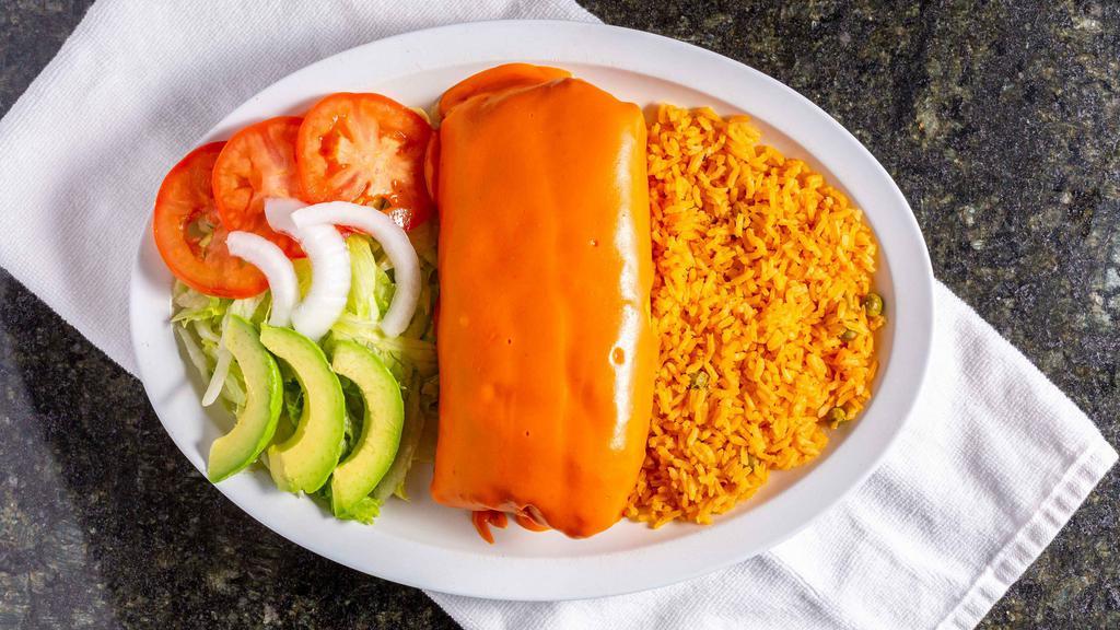 Chimichanga · Fried rolled flour tortilla topped with its special yellow cheese sauce, stuffed with beans, mozzarella cheese and the meat of your choice steak, pollo, pastor, carnitas, buche, cabeza, barbacoa, ground beef, or chorizo, tripas, tongue, arrachera, cecina.