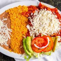 Chilaquiles · Homemade corn chip tortillas covered with green or red sauce and mozzarella cheese, topped w...