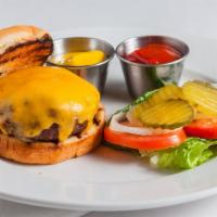 Majestic Steak Burger · 1/2lb. house ground tenderloin burger with choice of cheese and house-made chips