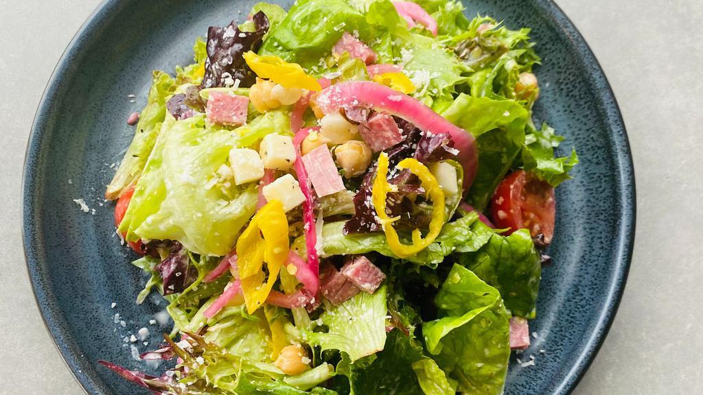 Chopped Salad · Chopped Mixed Greens, Soppressata, Provolone Cheese, Pickled Onion, Cherry Tomato, Pepperoncini, Chickpeas, Cucumber & Creamy Italian Vinaigrette