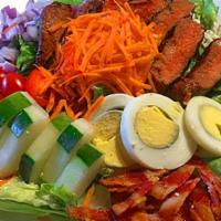 Steak Salad · Seared flat iron, mixed greens, blue cheese, grape tomatoes, red onion, cucumber, hard boile...