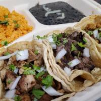 Taco Special · 3 tacos, meat or veggies, rice, beans, and drink.