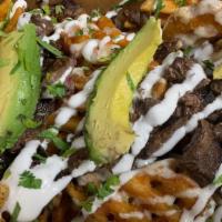 Dave'S Loaded Papas · Waffle fries topped with choice of protein, sour cream, queso sauce, avocado and cilantro