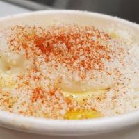Elote (Mexican Street Corn) · Mexican sweet corn in a cup, mayonnaise, butter, cotija cheese, chili piquin