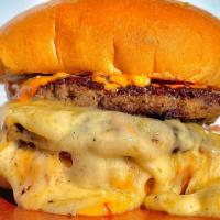 House Of Munster · Melted Munster cheese between two beef patties set on a brioche bun topped with our signatur...