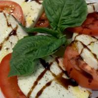 Caprese · Organic Roma Tomatoes, Fresh Mozzarella, and Fresh Basil drizzled with a Sweet Balsamic Redu...