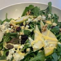 Delicata Salad · Organic Baby Arugula & Spring Mix, Fresh Anjou Pears, Crumbled Gorgonzola Cheese, Walnuts, D...