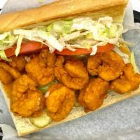 Firecracker Shrimp Po'Boy · Spicy. fried shrimp tossed in hot sauce on a bolillo roll served dressed with tomato, lettuc...