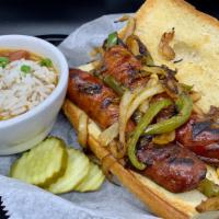 Sausage & Pepper Po'Boy · Spicy. andouille sausage grilled with peppers and onions on a bolillo roll with a spread of ...
